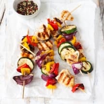 Grilled chicken skewers or shashlik with grilled vegetables and pepper